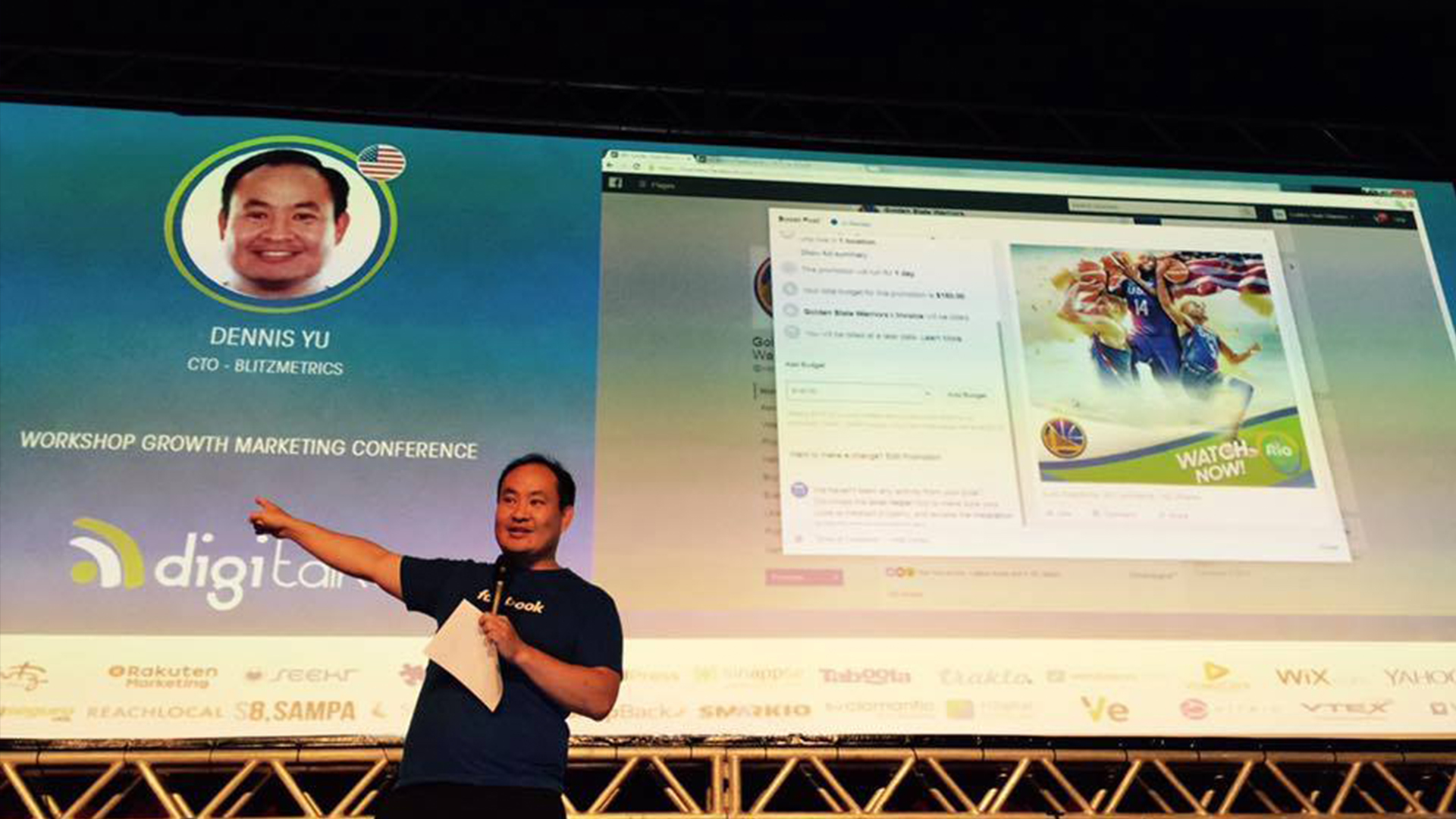 Dennis Yu speaking on stage