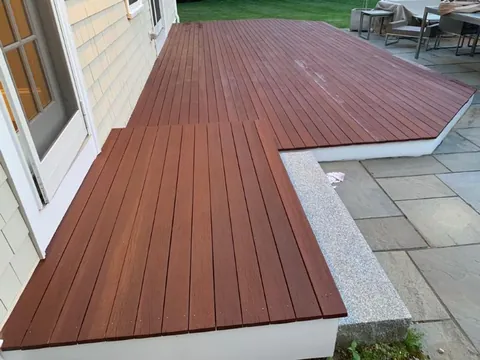 Deck staining vs painting in New England