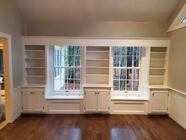White built-in cabinetry and window seat after painting by Target Painting