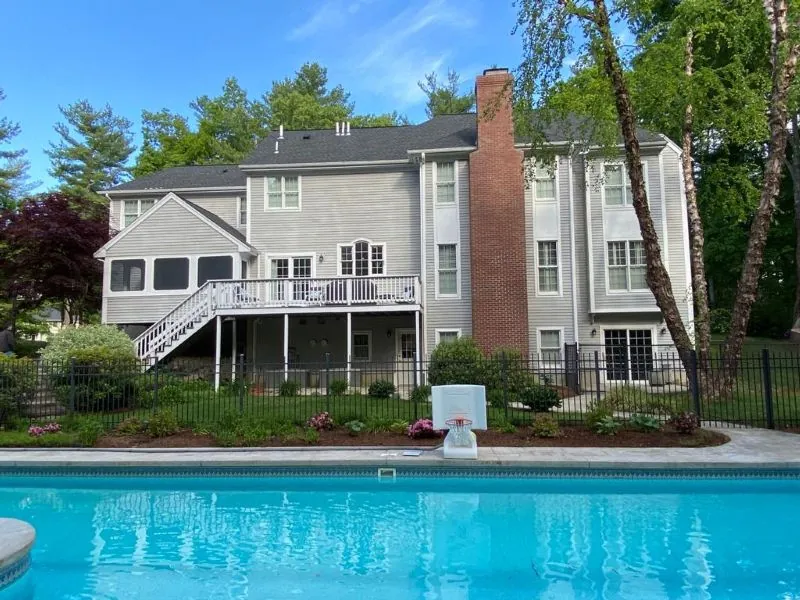 Gray poolside home exterior after painting by Target Painting